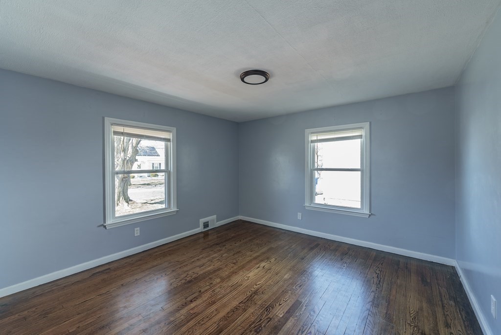 85 West Allen Ridge Road Springfield, MA 01118 - Photo 9 of 41 an empty room with wooden floor and windows