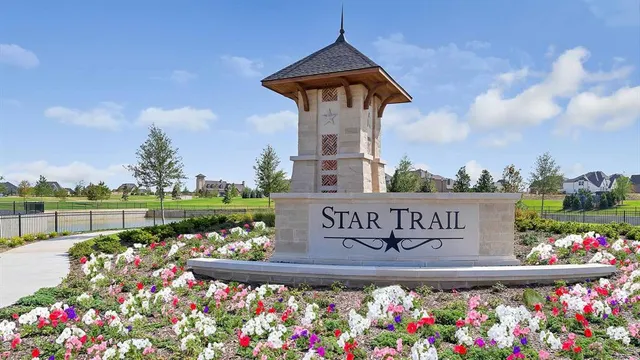 a view of sign board with flower around