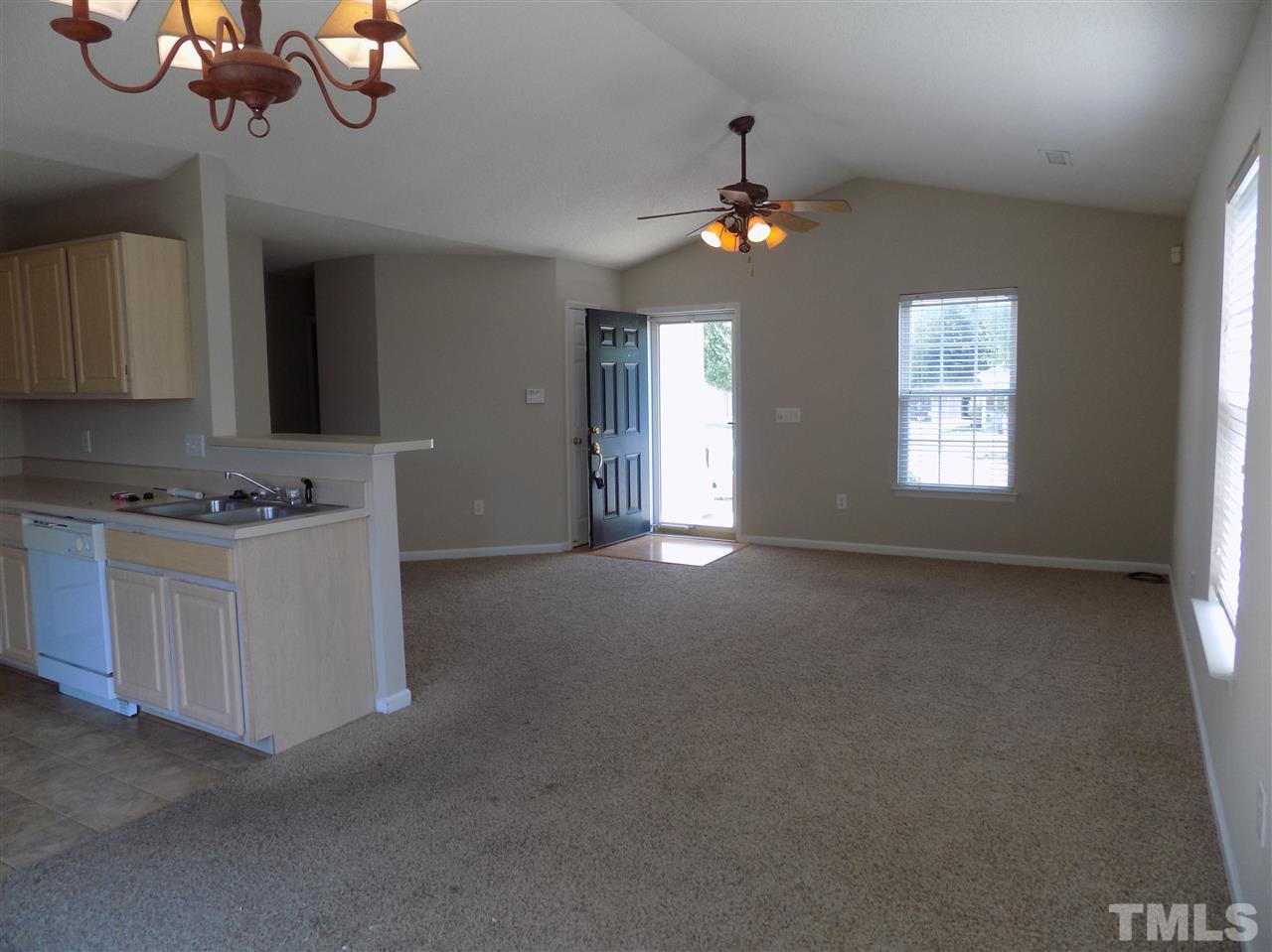 5401 Marthonna Way Raleigh, NC 27616 - Photo 4 of 12 a view of an empty room with a window