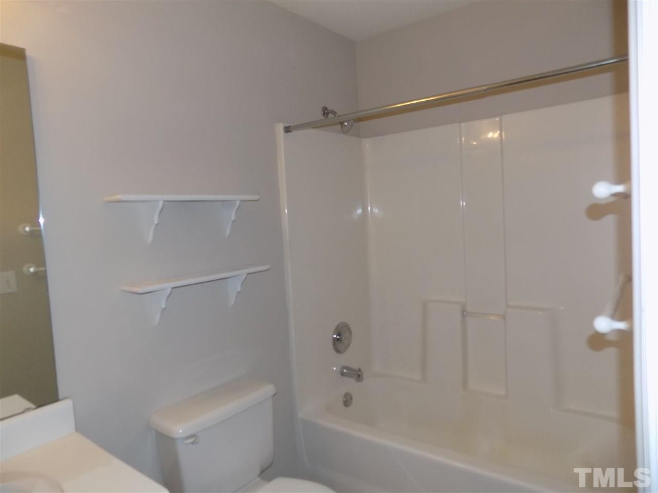 5401 Marthonna Way Raleigh, NC 27616 - Photo 7 of 12 a bathroom with a shower and a toilet