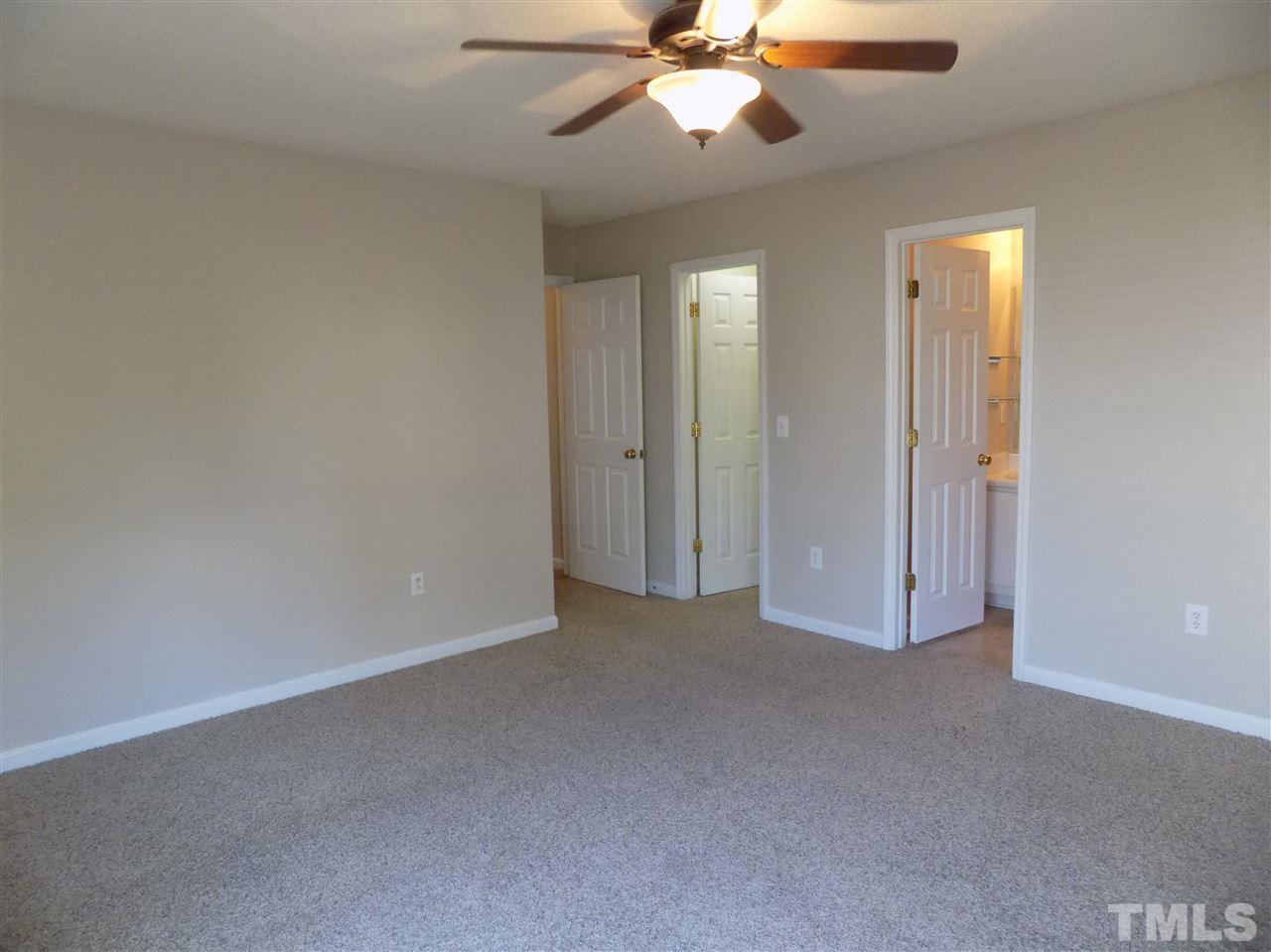 5401 Marthonna Way Raleigh, NC 27616 - Photo 8 of 12 an empty room with windows and fan