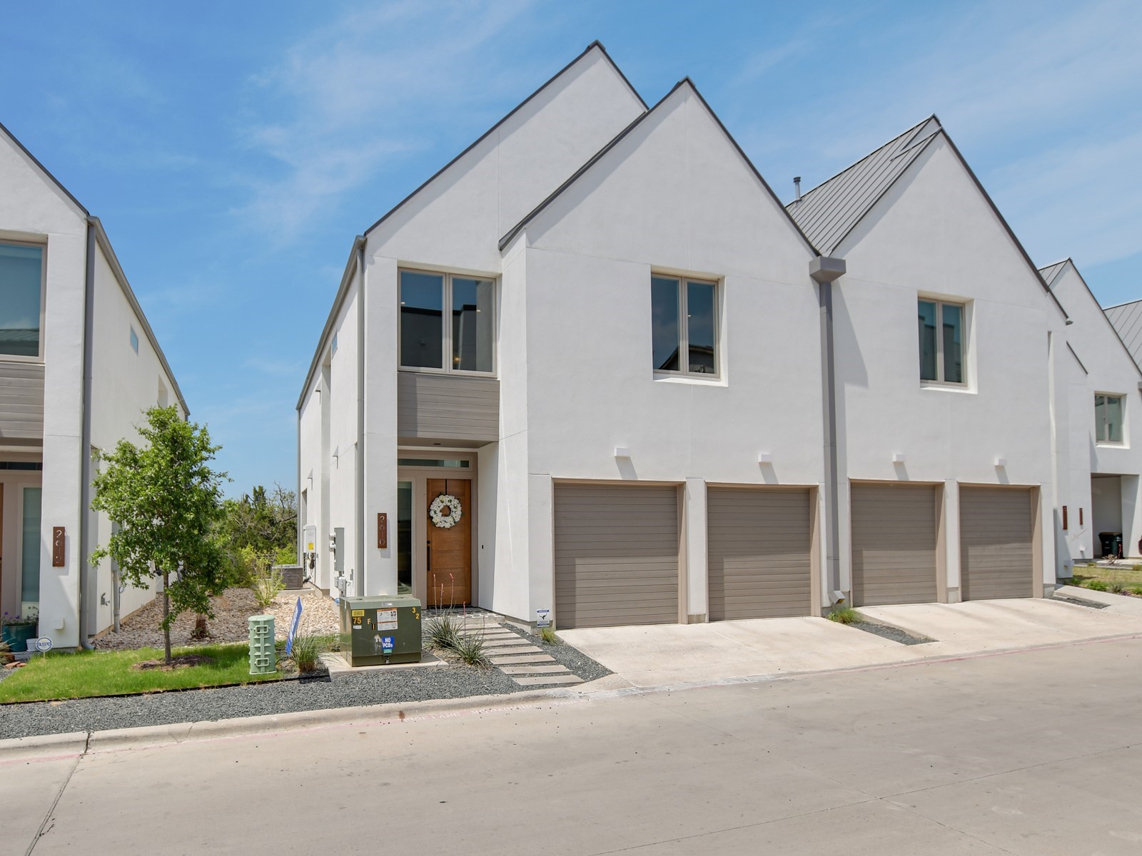 a view of a house with a yard and garage