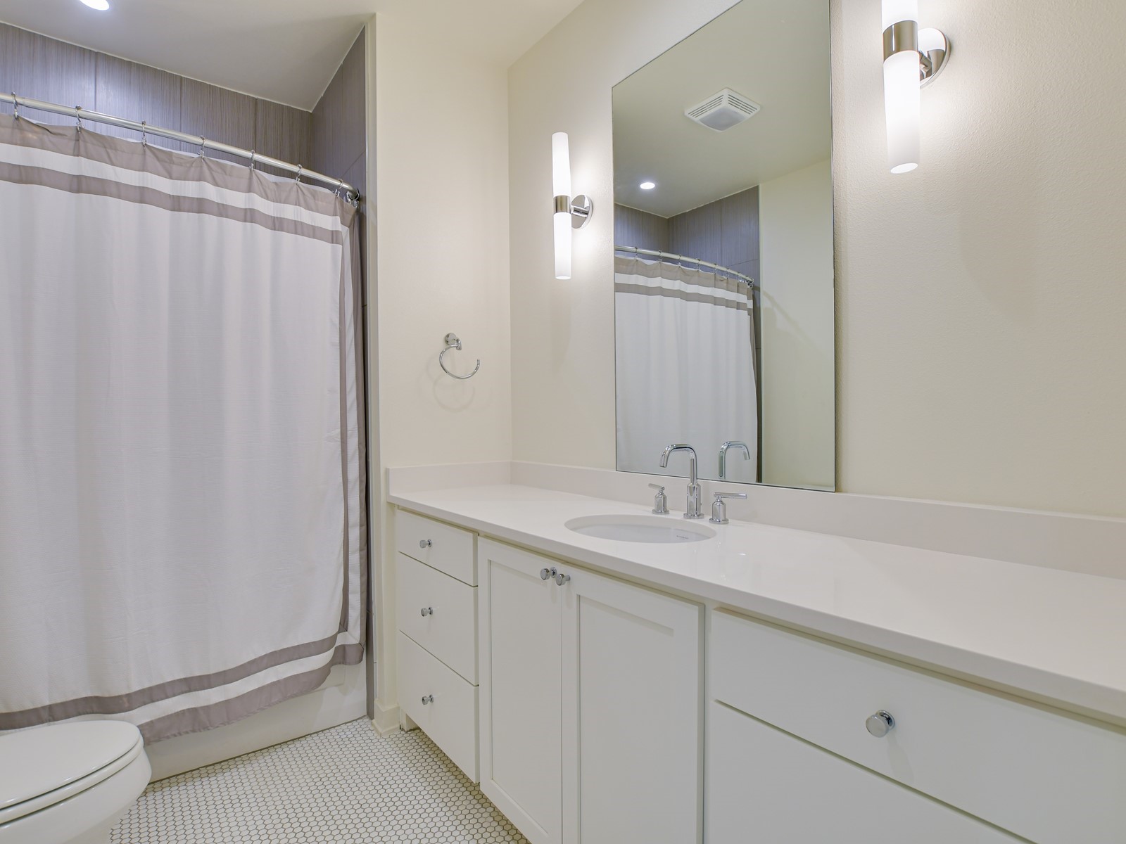 2610 Watkins Way Austin, TX 78746 - Photo 20 of 23 a bathroom with a double vanity sink and mirror
