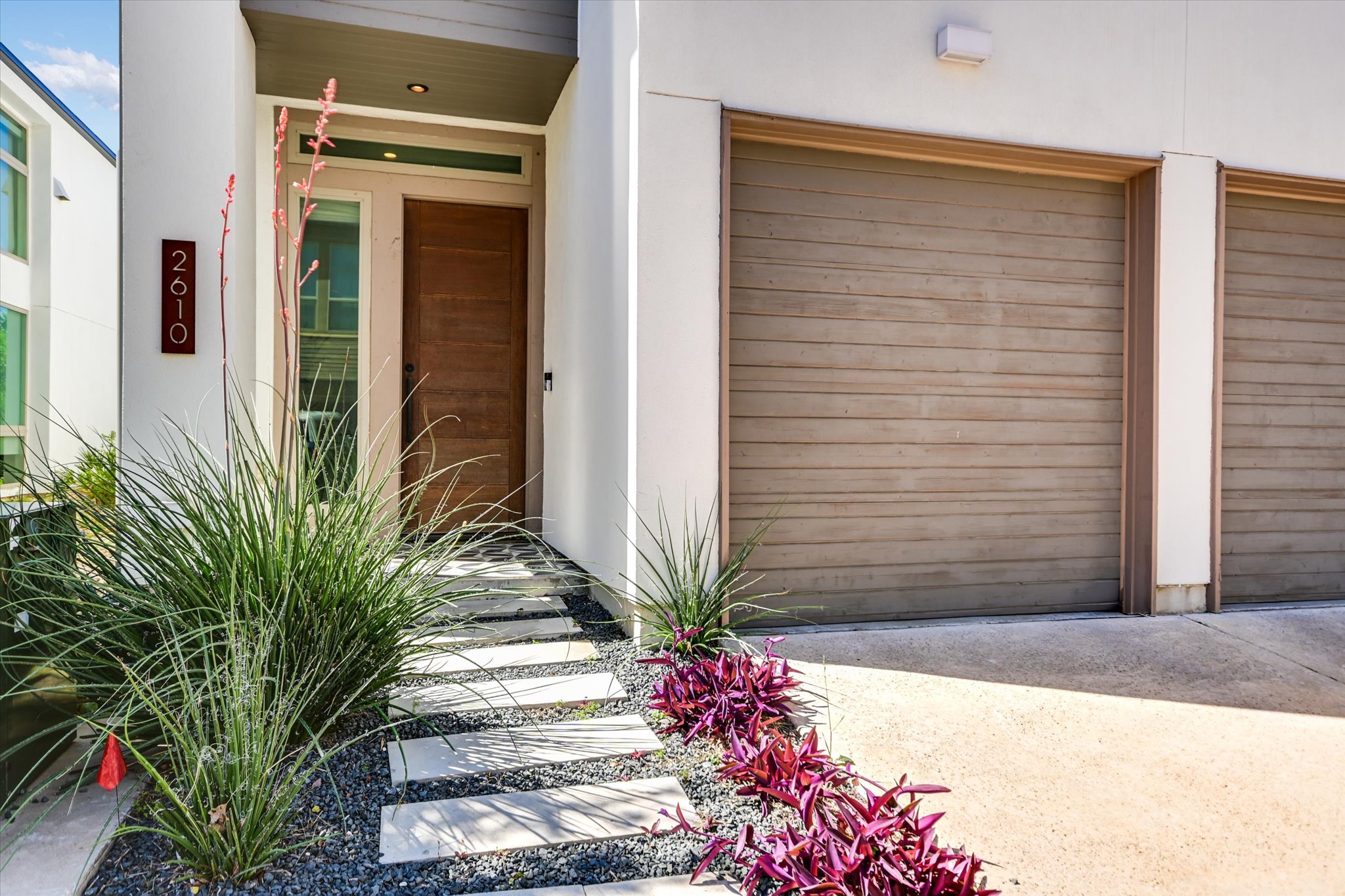 2610 Watkins Way Austin, TX 78746 - Photo 2 of 23 a potted plant sitting in front of a house