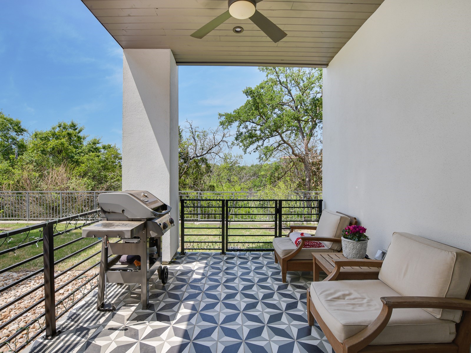 2610 Watkins Way Austin, TX 78746 - Photo 22 of 23 a outdoor living space with furniture and a potted plant