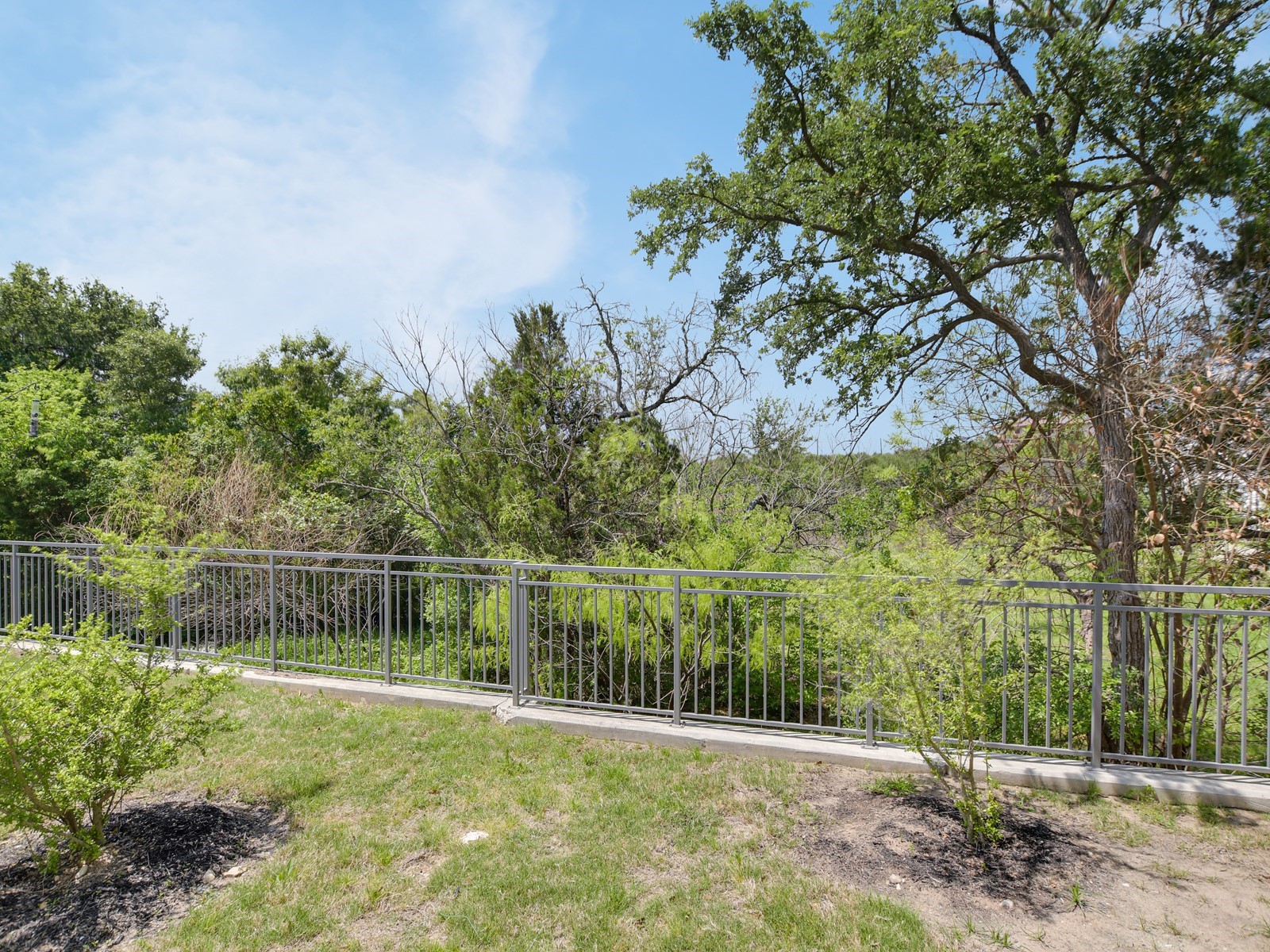 2610 Watkins Way Austin, TX 78746 - Photo 23 of 23 a view of a lake with a yard