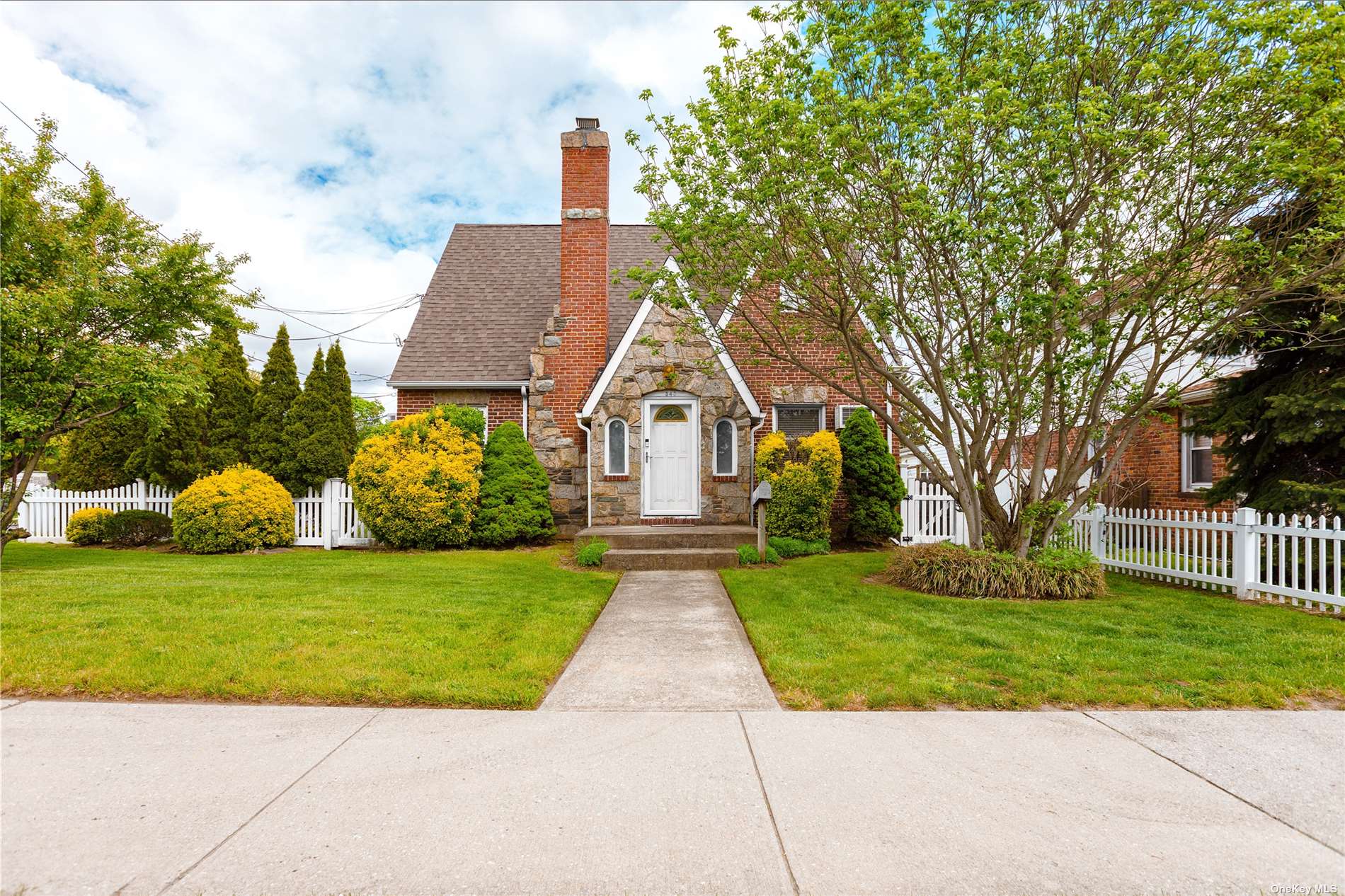 a front view of a house with yard