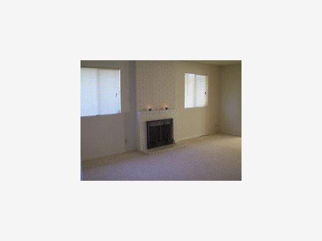 14589 Nassau Road San Leandro, CA 94577 - Photo 2 of 4 a open living room with a couch and a stove