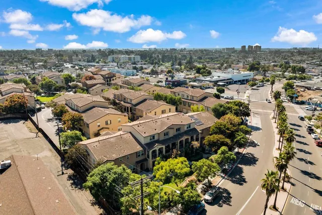 an aerial view of residential houses with outdoor space