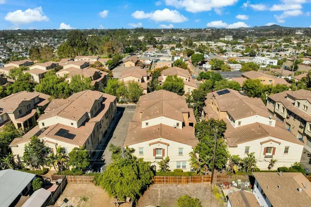 an aerial view of residential houses with outdoor space