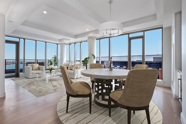a view of a dining room with furniture window and outside view