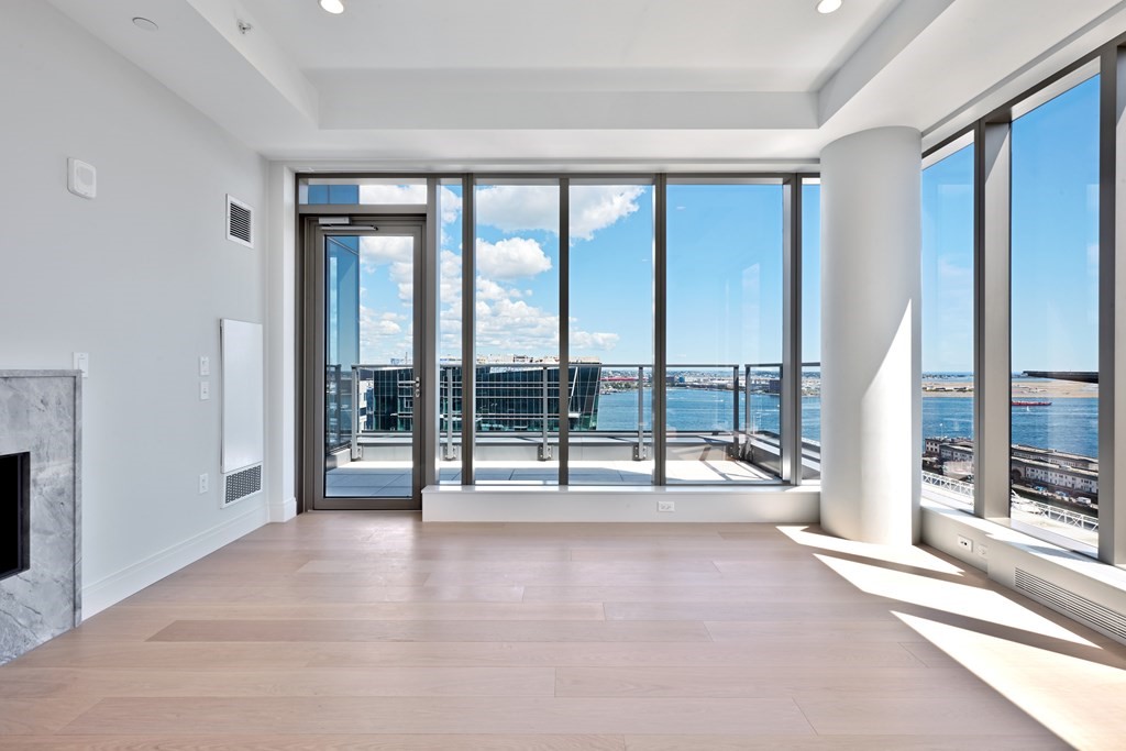 135 Seaport Boulevard, Unit PH3A Boston, MA 02210 - Photo 3 of 11 a view of an empty room and window