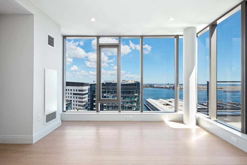 135 Seaport Boulevard, Unit PH3A Boston, MA 02210 - Photo 10 of 11 a view of workspace with furniture and large window