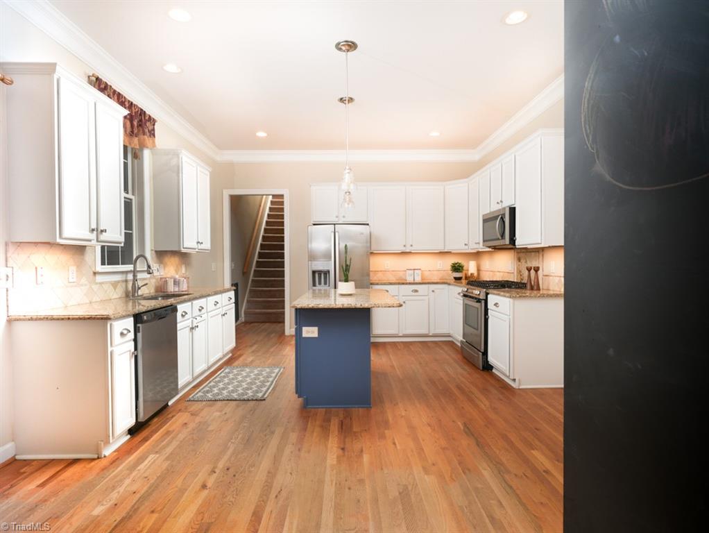 7840 Wilson Farm Road Summerfield, NC 27358 - Photo 12 of 47 Kitchen has plenty of cabinets and countertop space along with a breakfast area for quick meals.