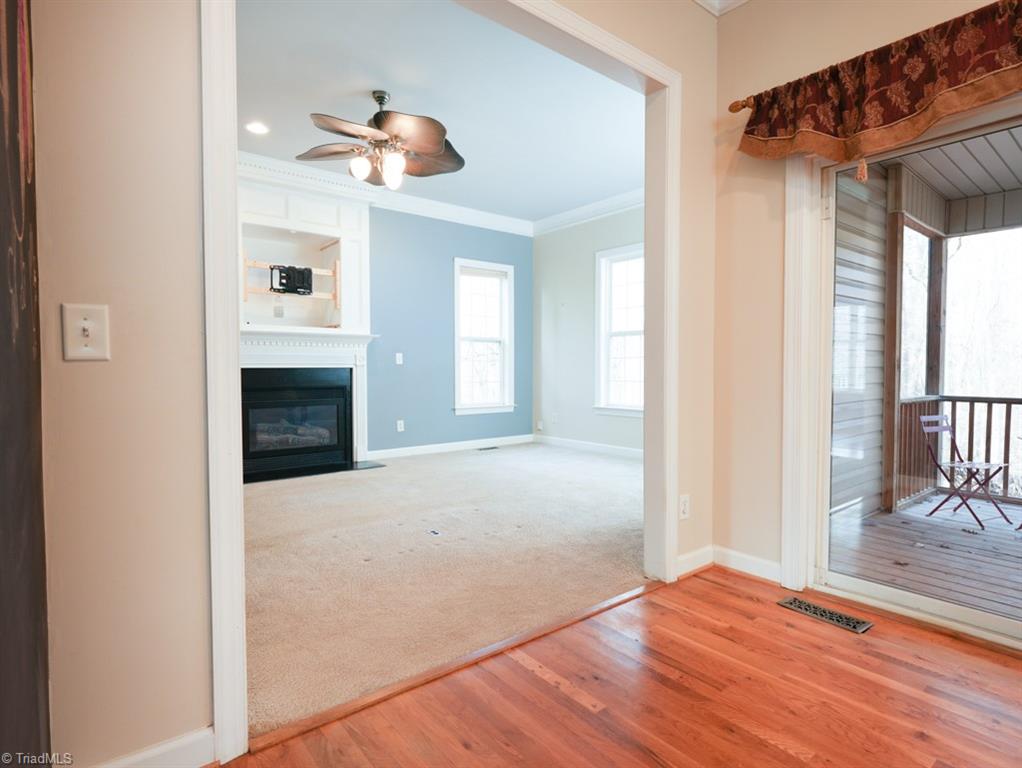 7840 Wilson Farm Road Summerfield, NC 27358 - Photo 15 of 47 Breakfast area opens into Den and also has access to screened-in porch.