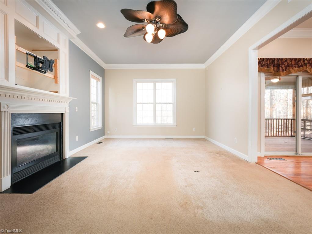 7840 Wilson Farm Road Summerfield, NC 27358 - Photo 16 of 47 Large Den with cozy fireplace, a great family gathering place.