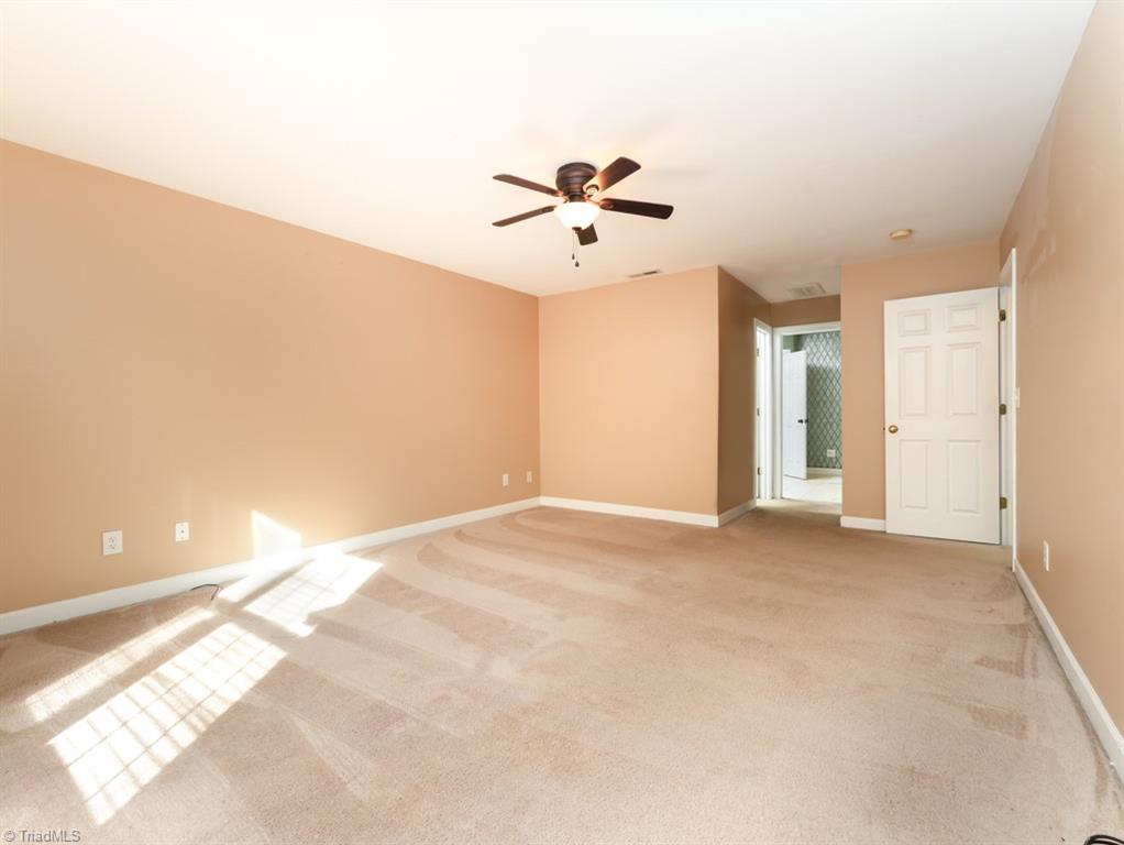 7840 Wilson Farm Road Summerfield, NC 27358 - Photo 20 of 47 Large primary bedroom on second level ensuite bathroom and two walk-in closets.