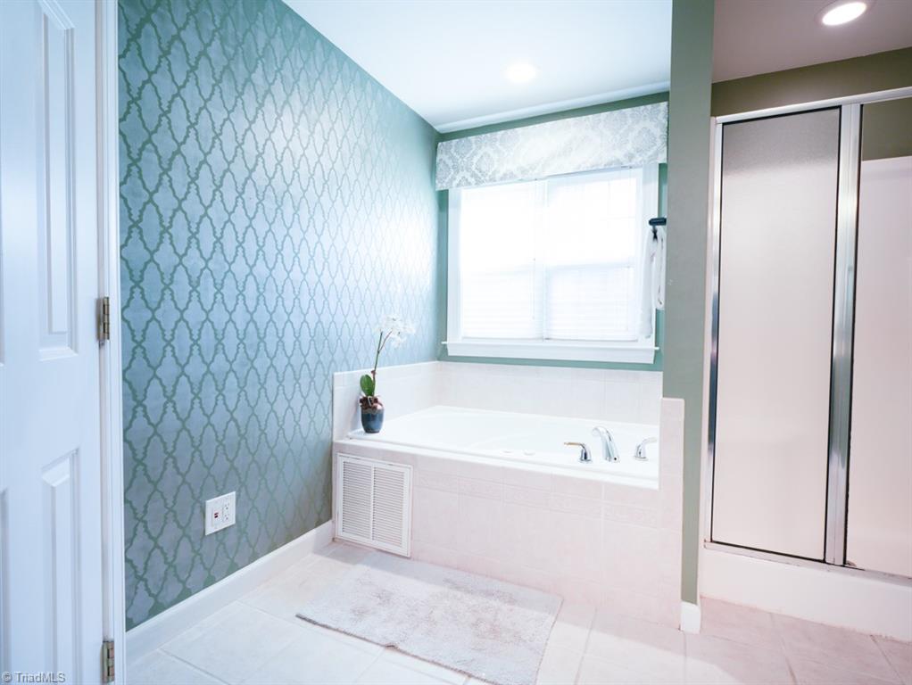 7840 Wilson Farm Road Summerfield, NC 27358 - Photo 24 of 47 Separate tub and shower.