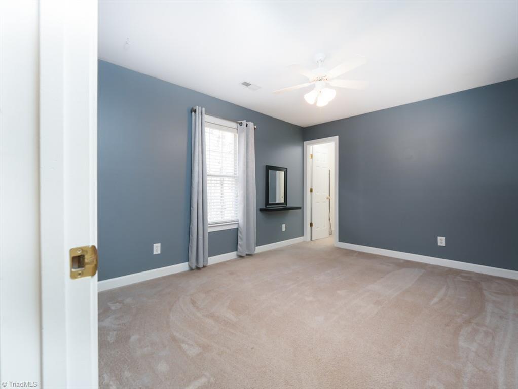 7840 Wilson Farm Road Summerfield, NC 27358 - Photo 31 of 47 Additional large bedroom on second level with walk-in closet.