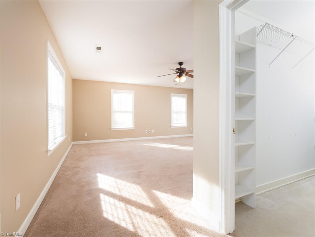 7840 Wilson Farm Road Summerfield, NC 27358 - Photo 34 of 47 Bonus room has large walk-in closet.