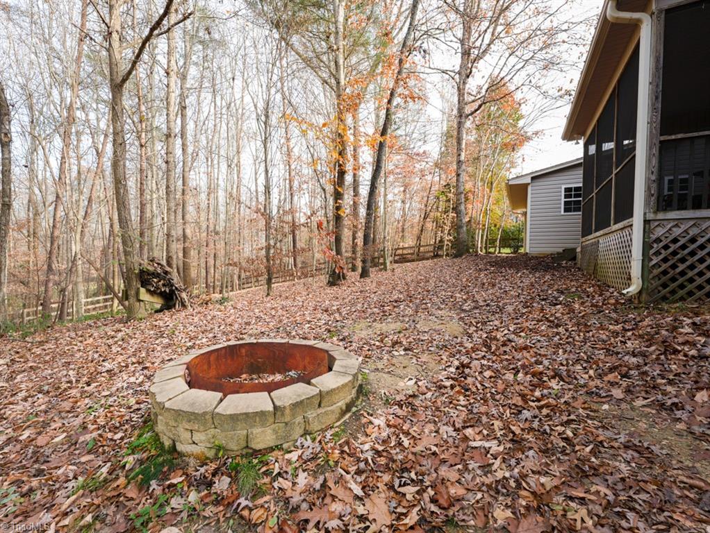 7840 Wilson Farm Road Summerfield, NC 27358 - Photo 38 of 47 Outdoor firepit to outdoor enjoyment.