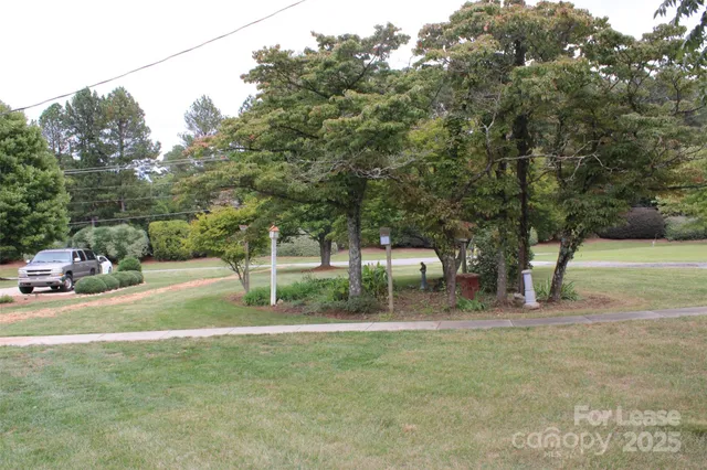 a backyard of a house with lots of green space