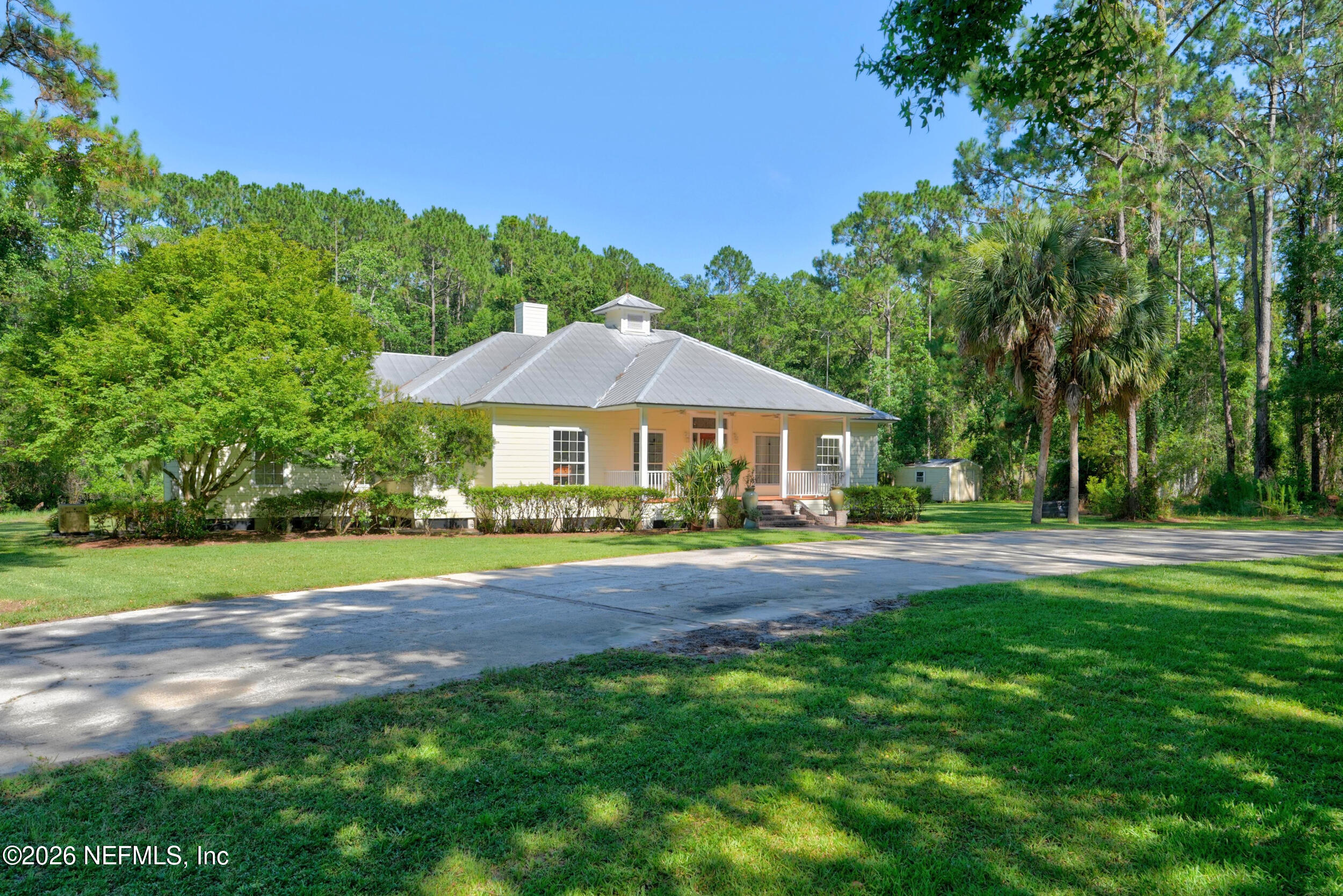 3090 Monument Bay Road St. Augustine, FL 32092 - Photo 3 of 56 a front view of a house with yard and green space