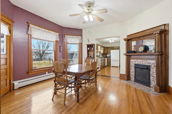 a view of a bedroom with wooden floor