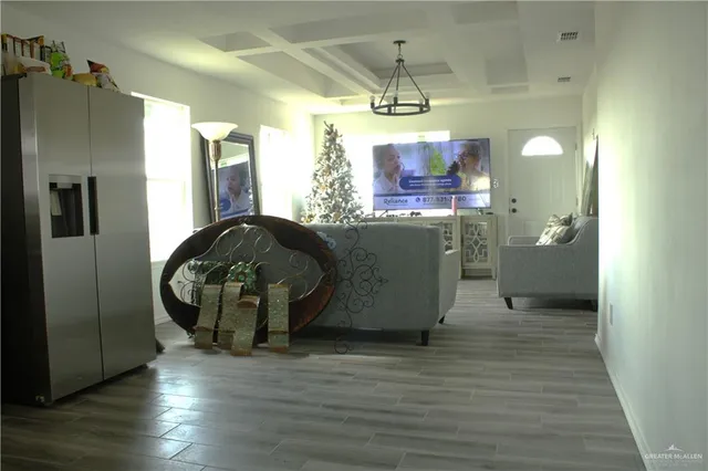 a view of kitchen and dining room with wooden floor