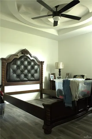 a view of living room with furniture and wooden floor