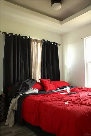 a bedroom with a bed and a closet