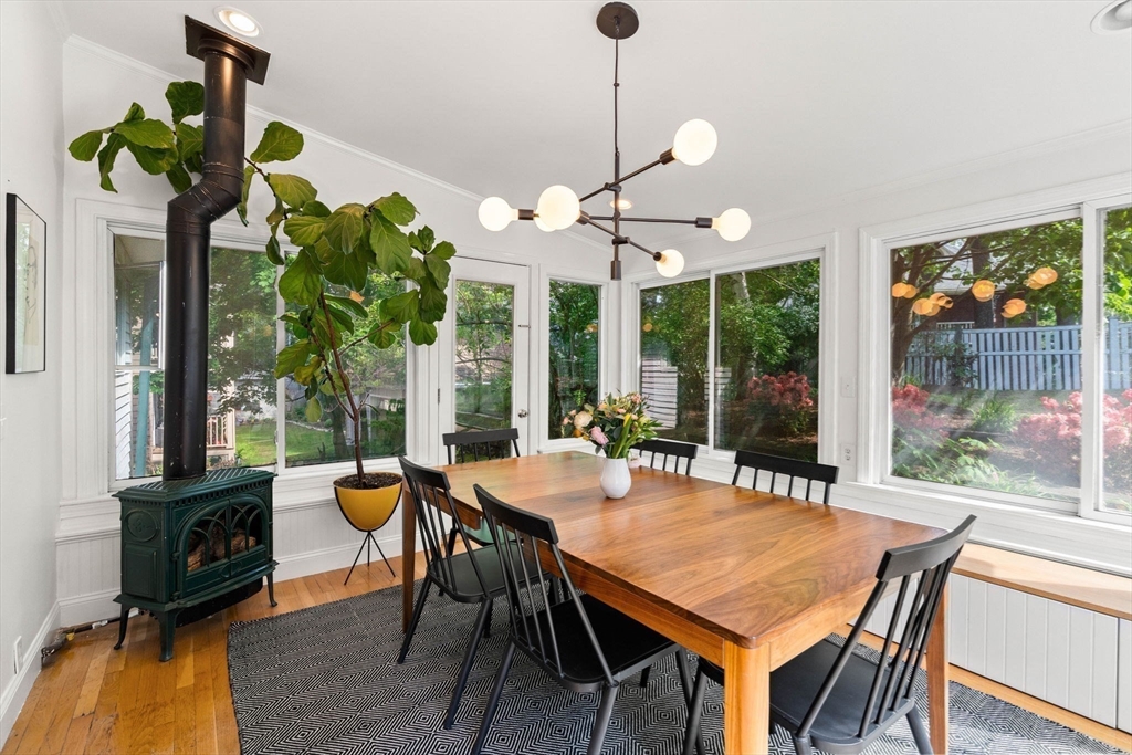 34 Avalon Road Milton, MA 02186 - Photo 25 of 42 a view of a dining room with furniture wooden floor and chandelier