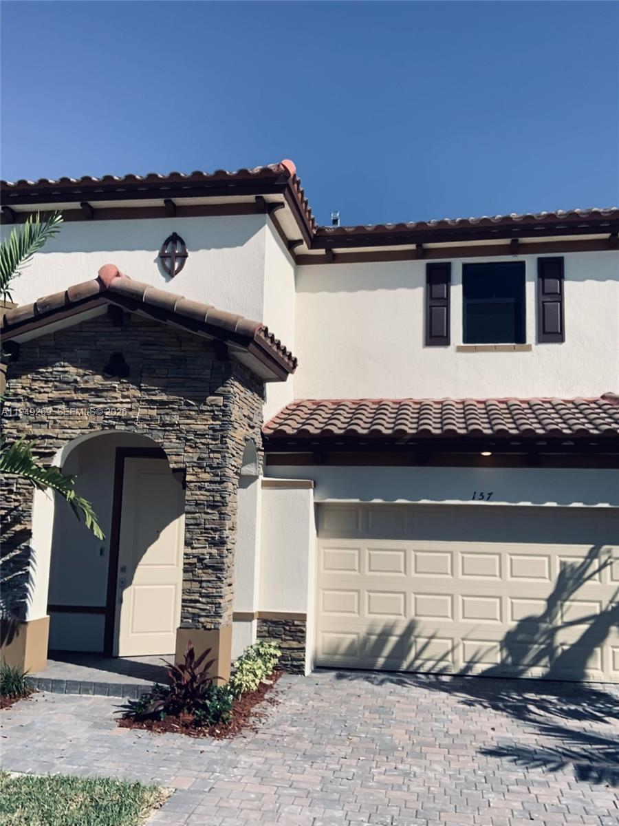 157 Northeast 27th Terrace, Unit 157 Homestead, FL 33033 - Photo 2 of 12 a front view of a house