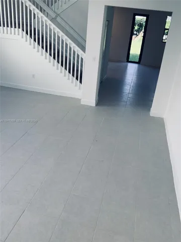 a view of a hallway with staircase