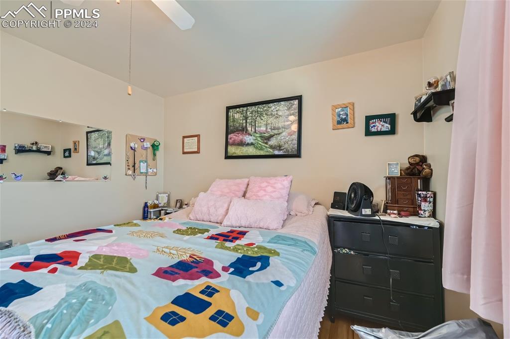 3103 Galley Road Colorado Springs, CO 80909 - Photo 13 of 25 a bedroom with a bed and closet