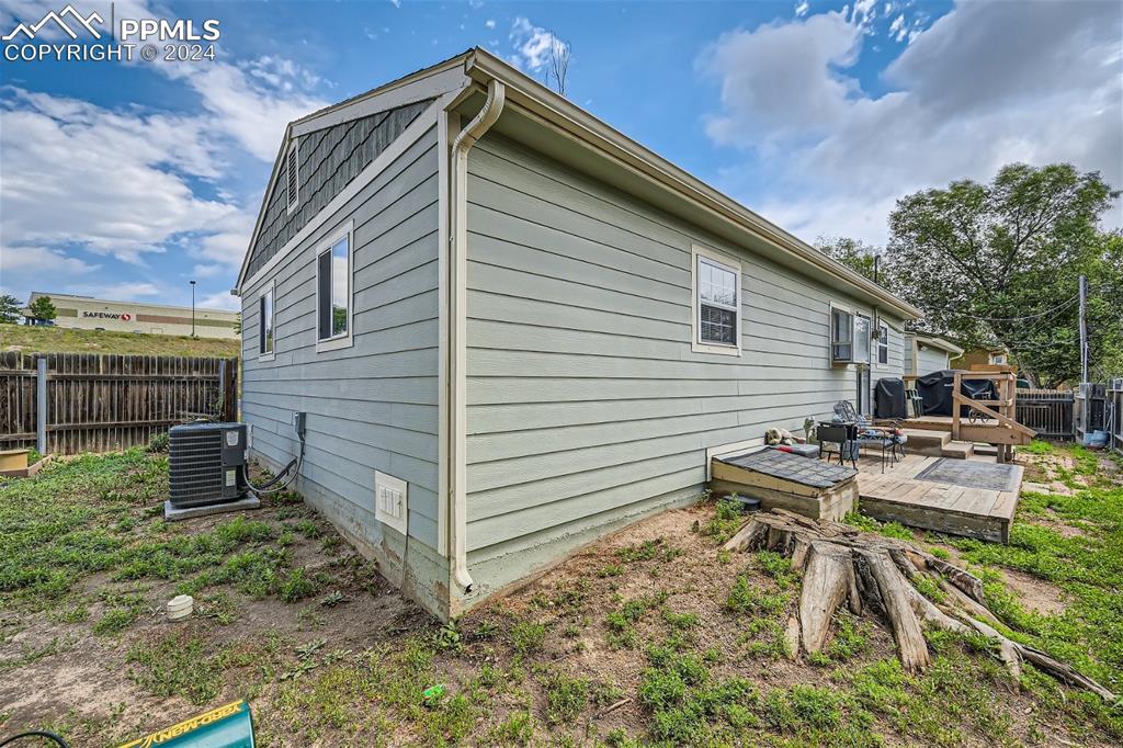 3103 Galley Road Colorado Springs, CO 80909 - Photo 20 of 25 a view of backyard with a table and chairs and potted plants