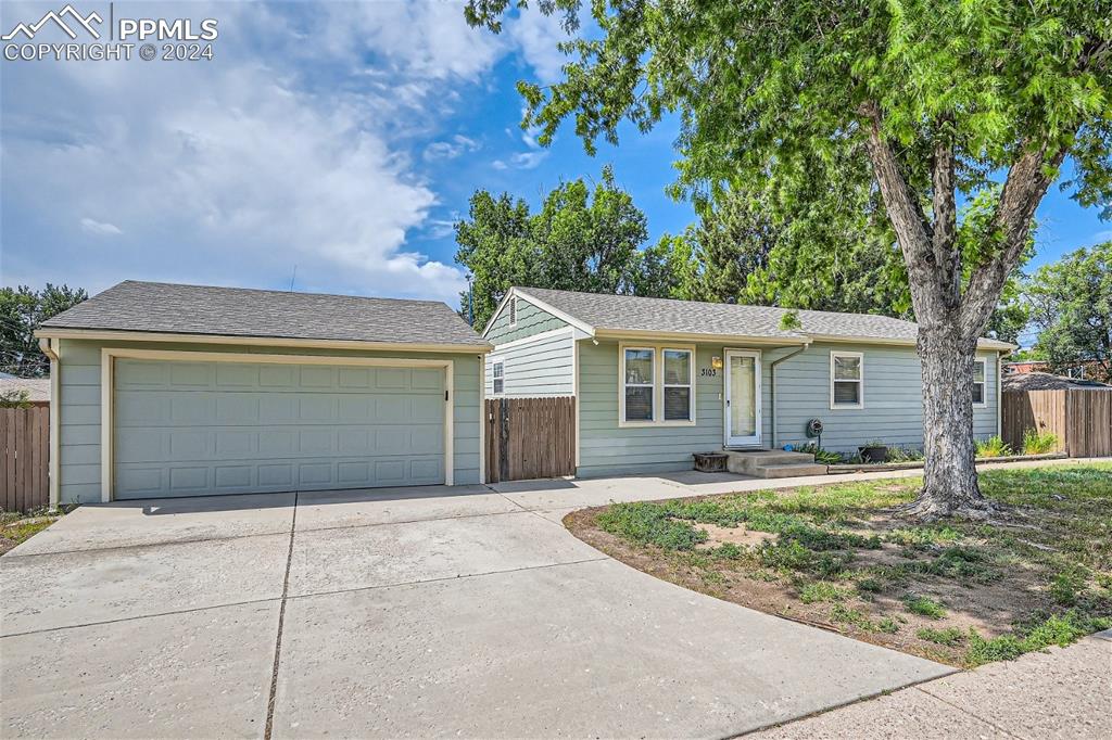3103 Galley Road Colorado Springs, CO 80909 - Photo 2 of 25 front view of a house with a yard