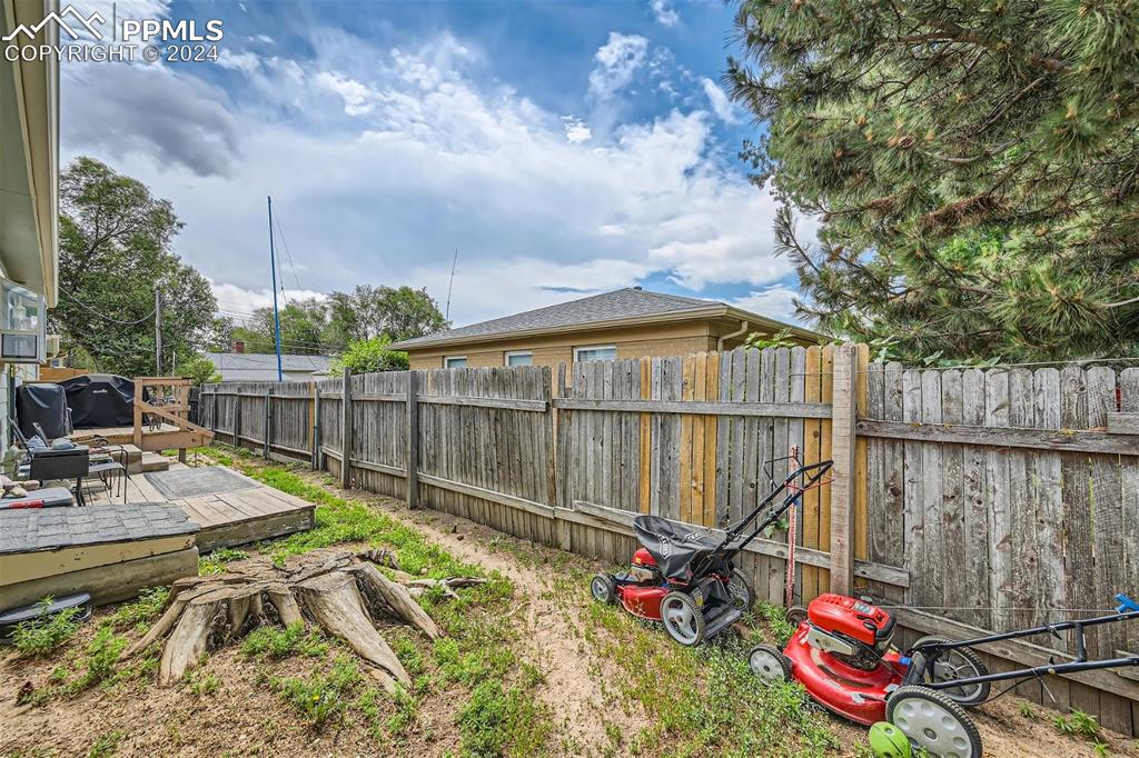 3103 Galley Road Colorado Springs, CO 80909 - Photo 23 of 25 a view of a deck with chairs next to a yard