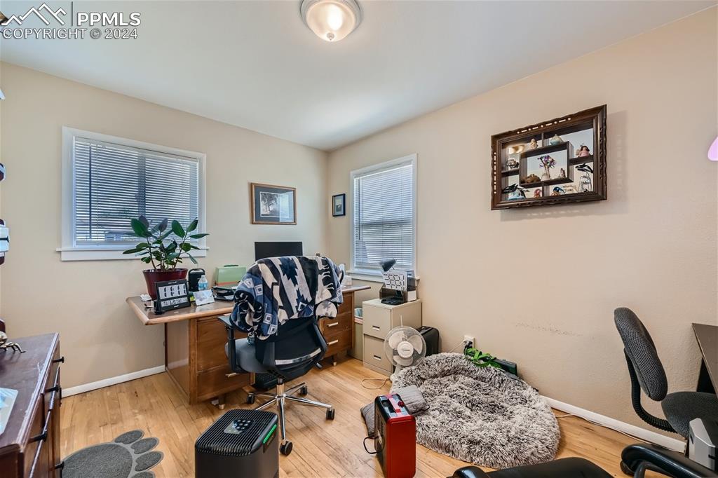 3103 Galley Road Colorado Springs, CO 80909 - Photo 10 of 25 a living room with furniture a window and a lamp