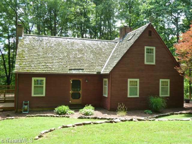 1100 Hemlock Ridge Road Germanton, NC 27019 - Photo 1 of 16 Exterior Front. Tranquil home on over 2 acres with giagantic deck, cedar shingles, real wood burnig fireplace. This is actually the left side of the home. The grass you see is about all the grass you will need to mow. It should take you only 10 minutes or so to mow.