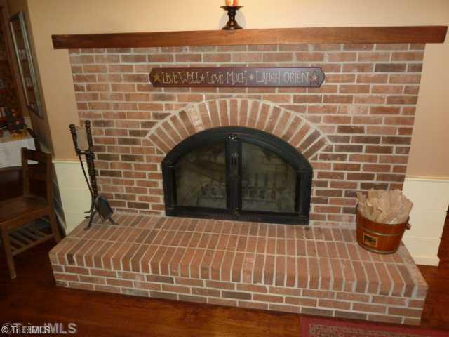 1100 Hemlock Ridge Road Germanton, NC 27019 - Photo 3 of 16 Living Room. Real Wood Burning Fireplace in the living room. Not the run of the mill fireplace, this is arched with elegant arched glass doors.