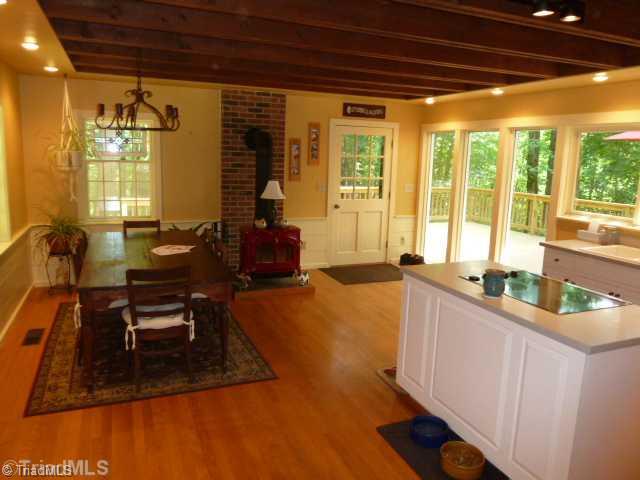 1100 Hemlock Ridge Road Germanton, NC 27019 - Photo 4 of 16 Kitchen. This view of the kitchen shows the dining area and access to the huge deck.