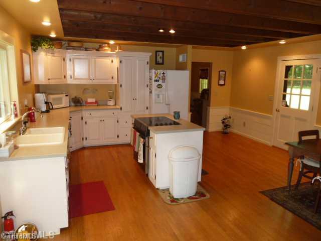 1100 Hemlock Ridge Road Germanton, NC 27019 - Photo 5 of 16 Kitchen. Reverse view of the kitchen area shows the Corian Counters, Island & tons of cabinets