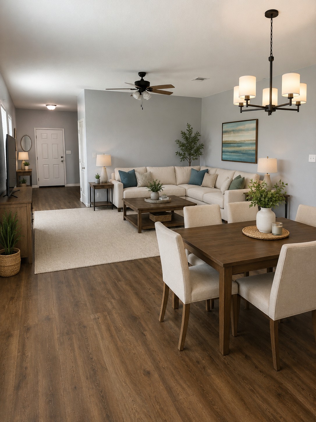 109 Helios Drive Jarrell, TX 76537 - Photo 7 of 36 a living room with furniture a chandelier and a dining room