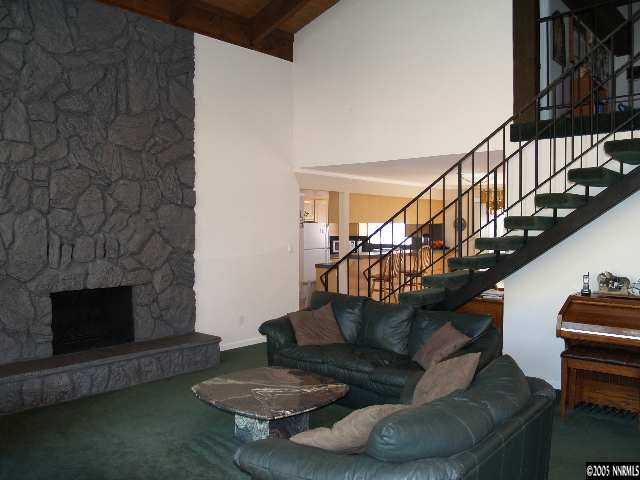 266 Chimney Rock Road Stateline, NV 89449 - Photo 4 of 9 a living room with furniture and a fireplace
