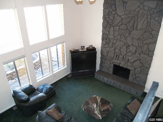 266 Chimney Rock Road Stateline, NV 89449 - Photo 9 of 9 a living room with furniture and a fireplace