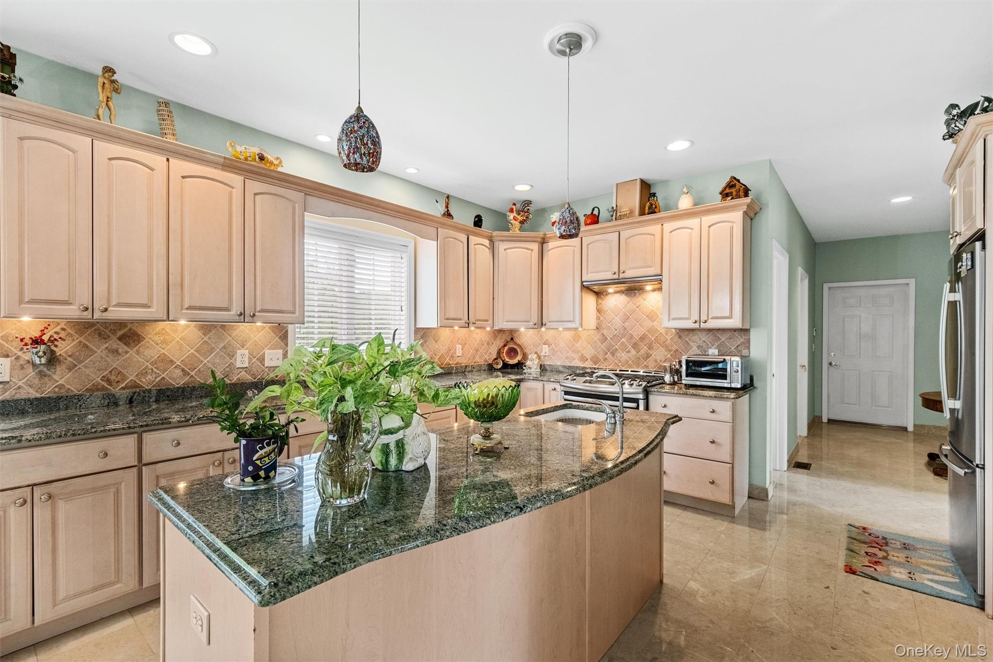 20 Goshen Road Chester, NY 10918 - Photo 16 of 38 a kitchen with stainless steel appliances granite countertop a sink a stove and a wooden floors