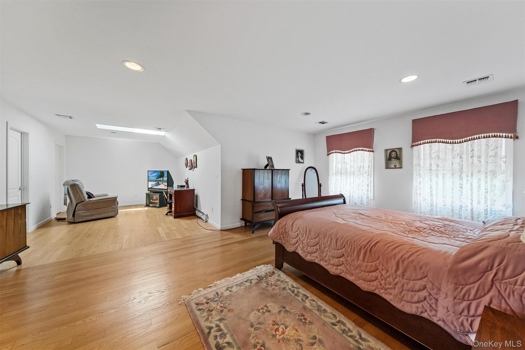 20 Goshen Road Chester, NY 10918 - Photo 25 of 38 a spacious bedroom with a bed and a couch