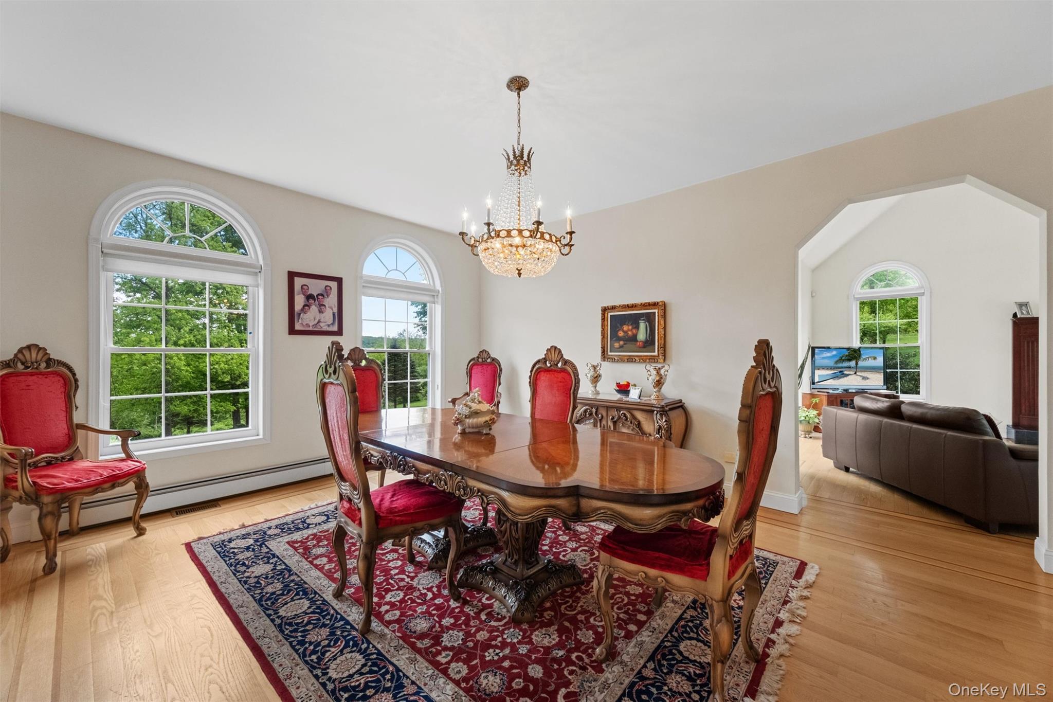 20 Goshen Road Chester, NY 10918 - Photo 7 of 38 a dining room with furniture a rug and a chandelier