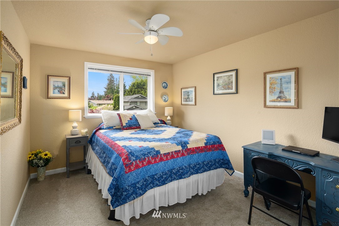 2329 169th Place Southeast Bothell, WA 98012 - Photo 11 of 18 a bedroom with a bed and a window